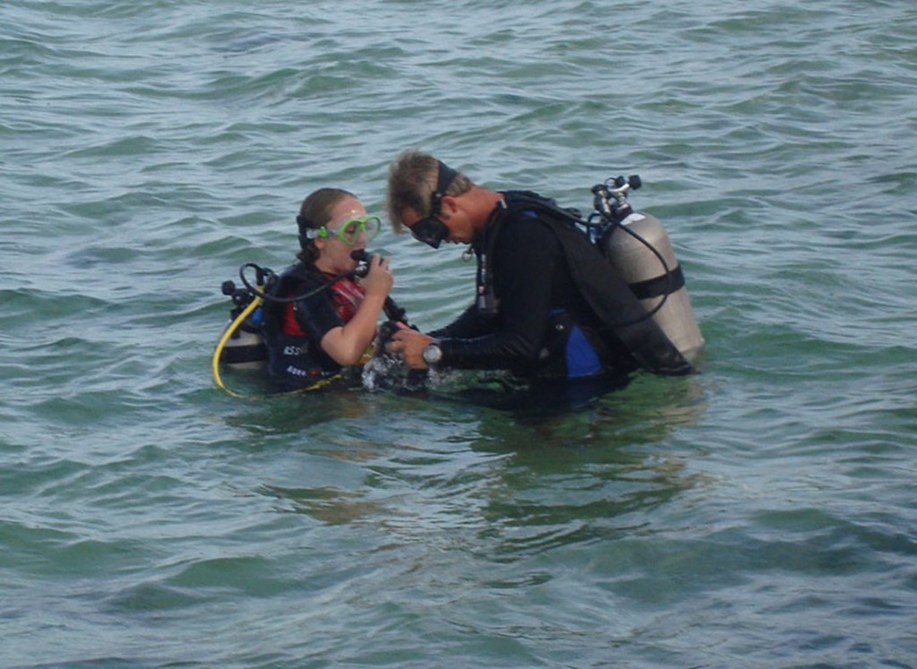 9-year-old Elena Rankin preparing for her Bubblemaker dive with Red Sail Sports instructor Travis Danley in Grand Cayman