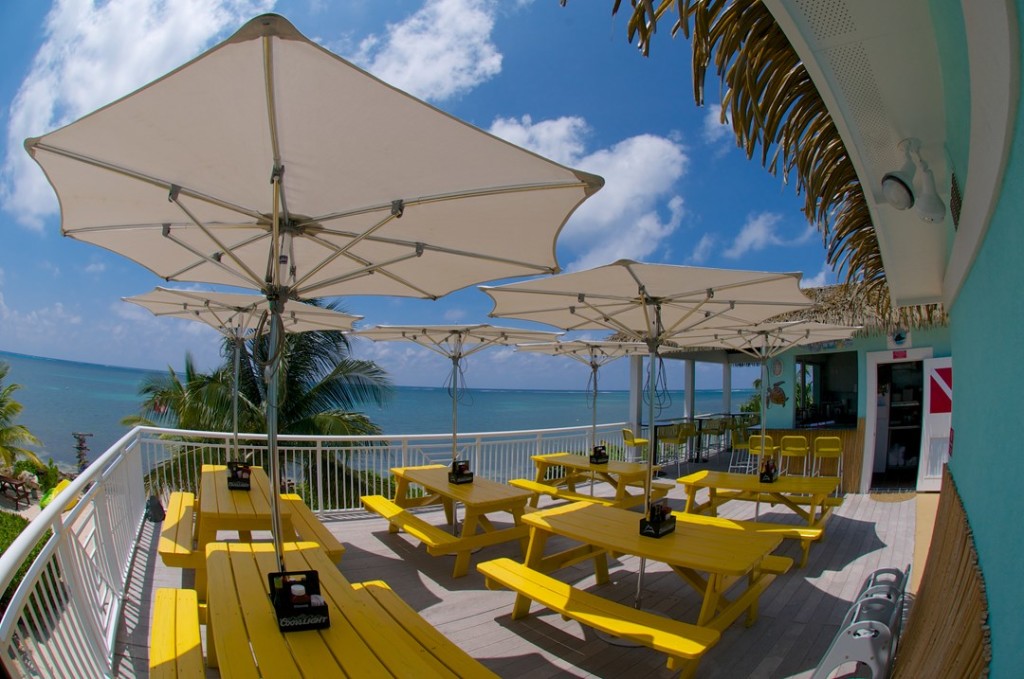 Bright Caribbean colors and a great view of the sea to enjoy lunch or dinner at Eagle Ray's Dive Bar and Grill at the Compass Point Resort on Grand Cayman's East End.