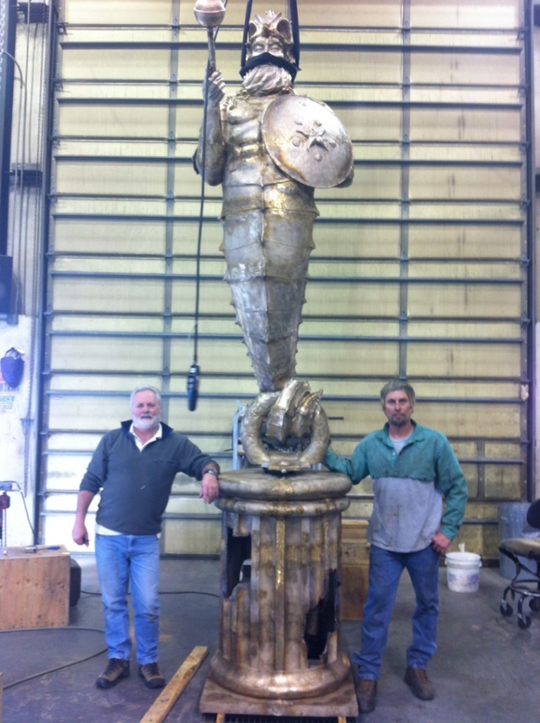 Fresh from the foundry and on his way to become an artificial reef in the Cayman Islands, the Guardian of the Reef will be making a stop during his journey at the Dive Equipment and Manufacturers Show (DEMA) in Orlando Nov 6 - 9. Artist Simon Morris is on the left of the sculpture base. Photo courtesy Simon Morris.