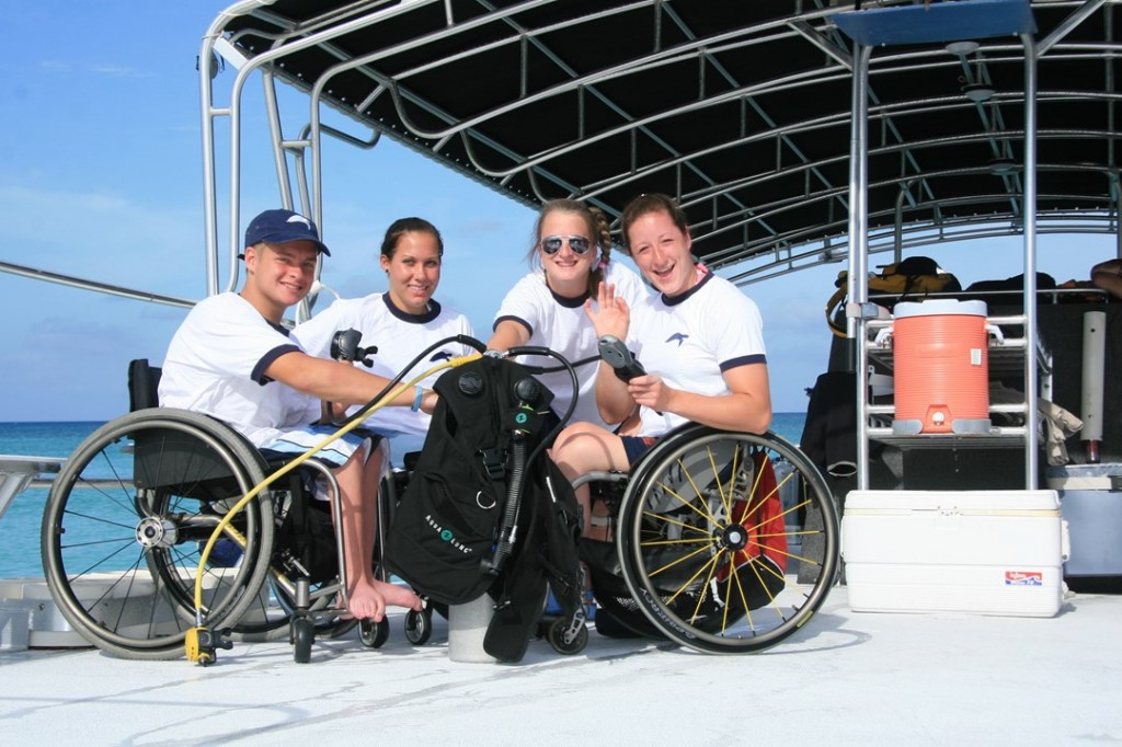 Aboard a spacious Red Sail Sports boat are from left to right Stay-Focused members: Brian Siemann, Jenn Poist, Gail Gaeng, and Tatyana McFadden. Brian and Gail are Stay-Focused mentors and will be in Grand Cayman again this summer diving 