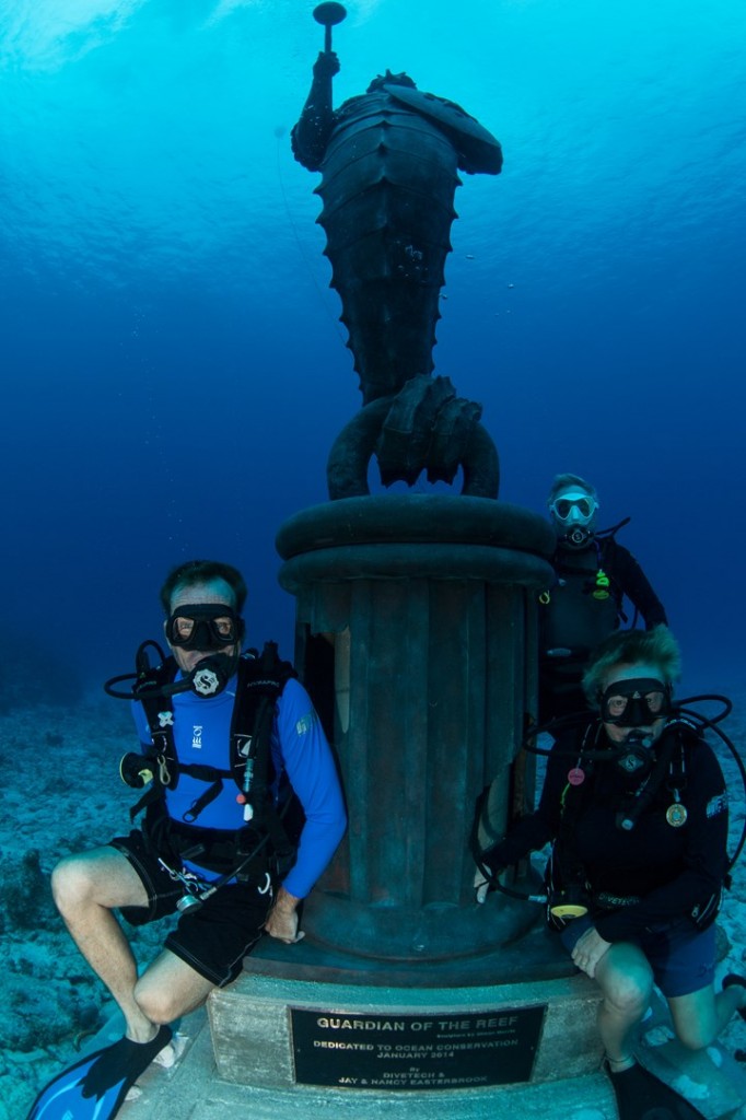 The 13-foot bronze sculpture sits on a 4 foot concrete pedestal raising its height to 17 feet. The Guardian's head is approximately 40 feet from the surface making it a great site for free divers too. Photo courtesy DiveTech