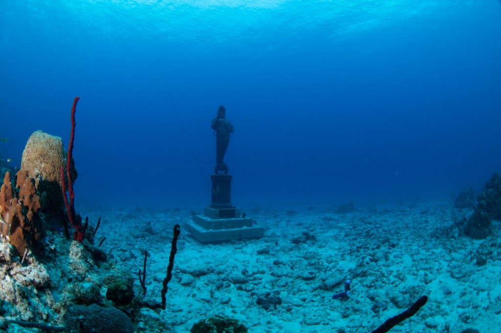 The Guardian of the Reef sits on a sandy flat near the mini-wall of the reef at Northwest Point. As you approach the site from shore, the sculpture comes into view. Photo courtesy DiveTech.