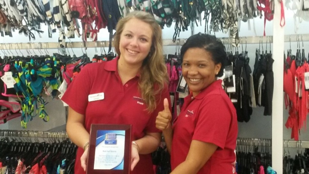All smiles at one of Red Sail Sports' retail shops are Sarah Guderian (L) and Allison Lawson. All company employees were surveyed and they had a chance to discuss the good things about their jobs. Photo courtesy Red Sail Sports.