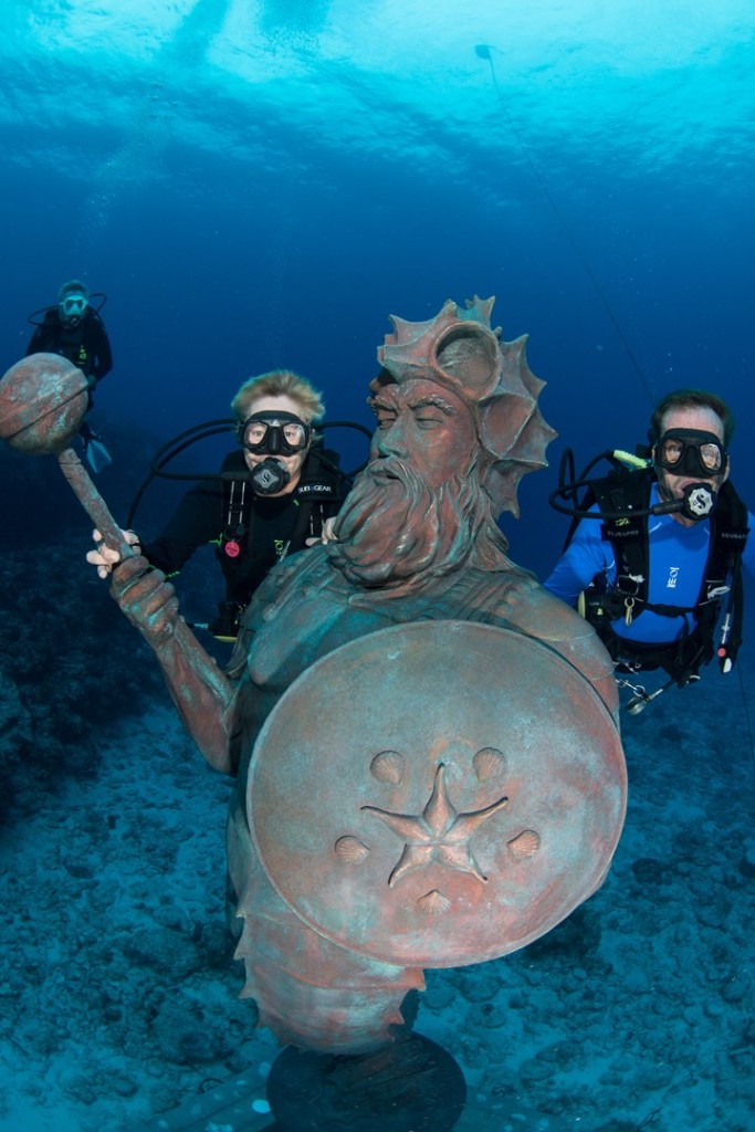 Nancy and Jay Easterbrook welcome the Guardian of the Reef to his new home at Northwest Point. One dollar from every dive on the site will go toward ocean conservation education. Photo courtesy Divetech