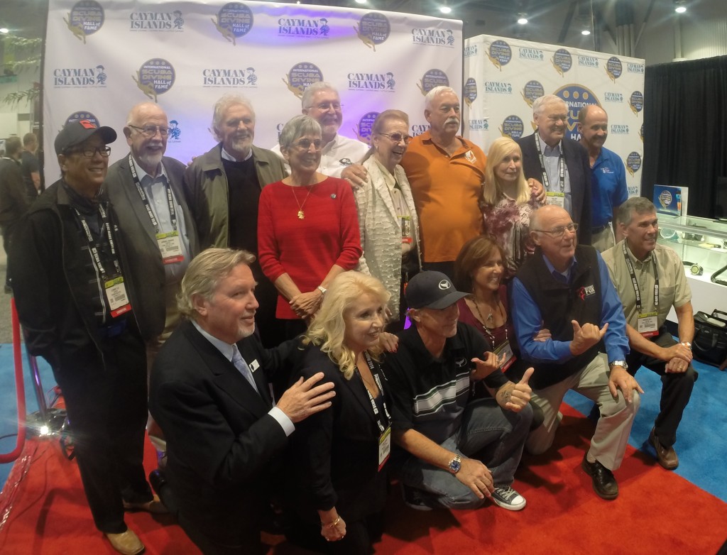 Past and present dive legends inducted into the International Scuba Diving Hall of Fame stop by at the ISDHOF booth in the Cayman section at DEMA for a photo op.